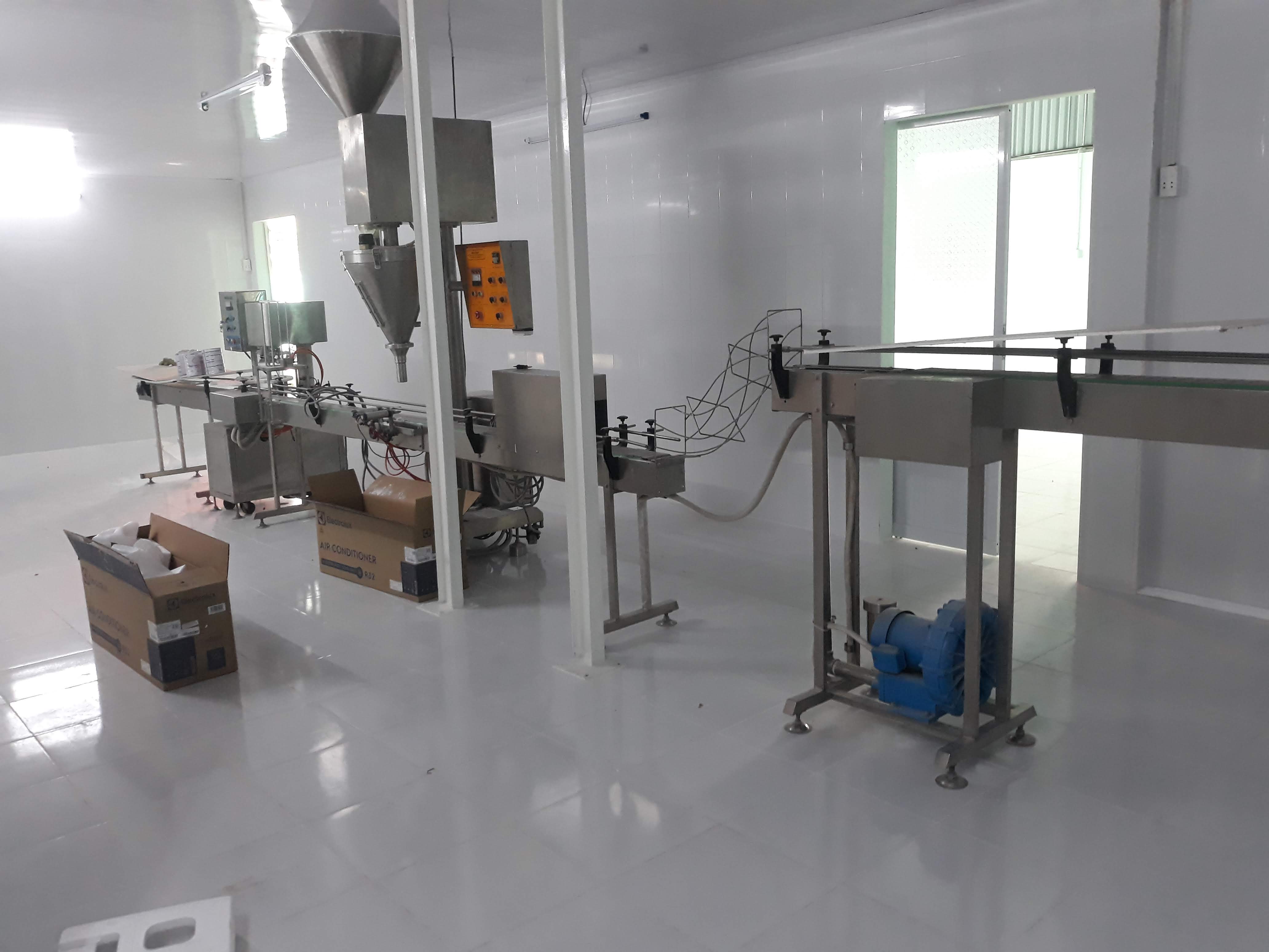 Dây chuyền chiết - ghép lon sữa bột tự động 